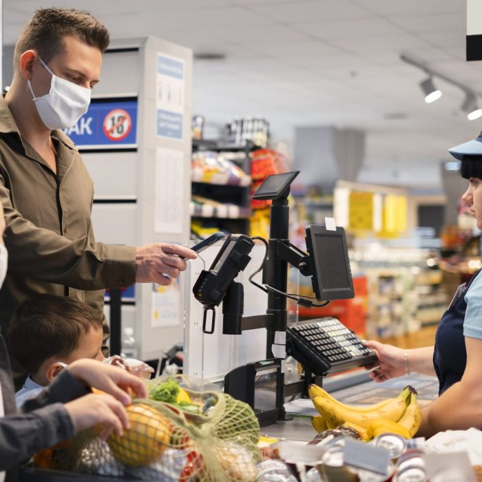 family-shopping-with-face-mask grocery store pos